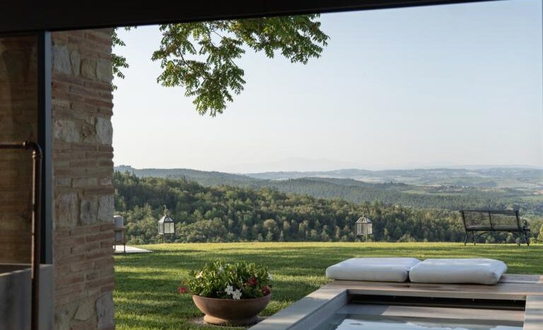 Private swimming pool overlooking Chianti vineyards at luxury Tuscan villa