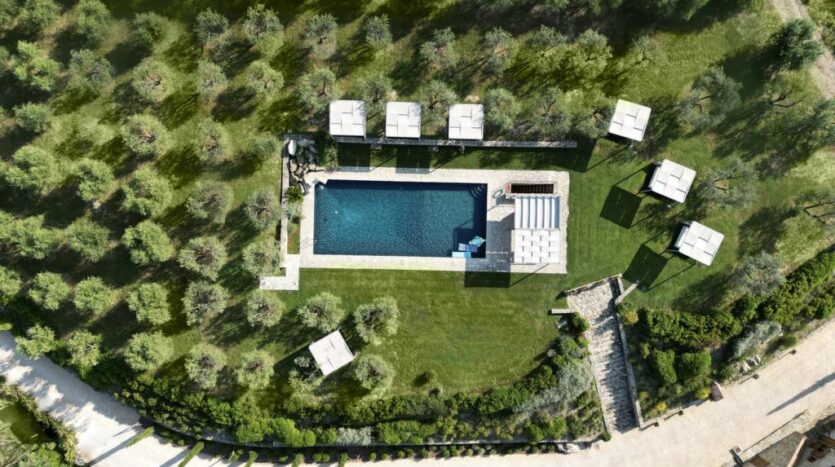 Private swimming pool overlooking Chianti vineyards at luxury Tuscan villa